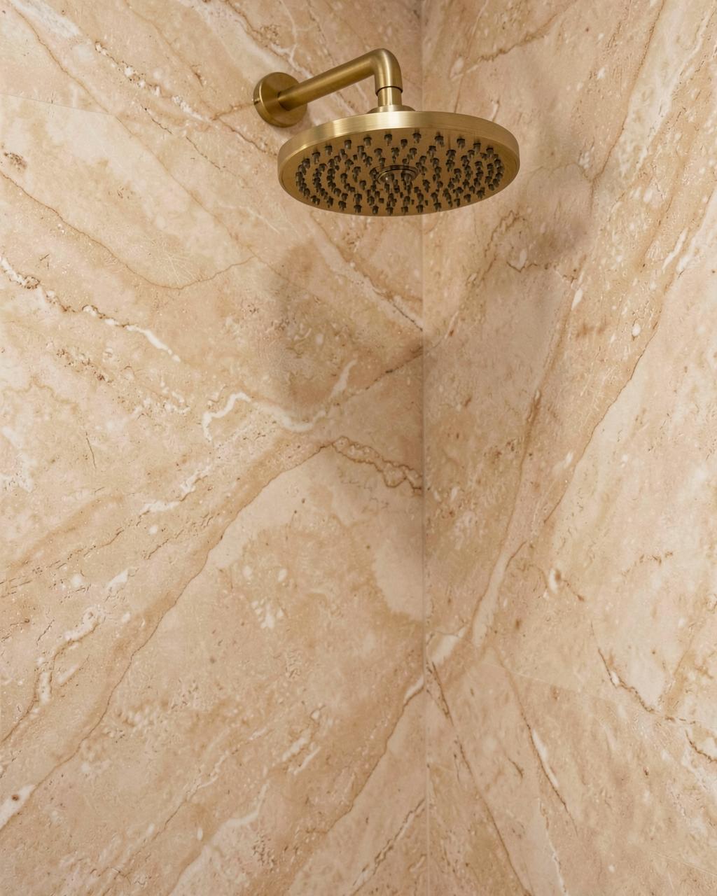 Close-up of marble-look acrylic wall panels with seamless corner shelf